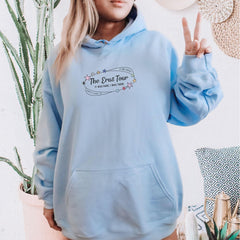 a woman wearing a blue hoodie with a peace sign