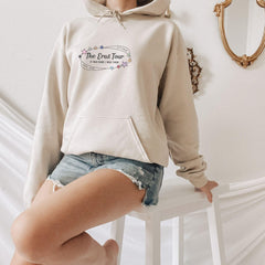 a woman in a white hoodie is posing for a picture