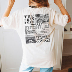 a woman standing in front of a mirror wearing a white shirt