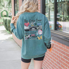 a woman standing outside of a building wearing a green jacket