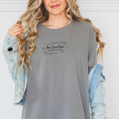 a woman wearing a gray shirt and jeans