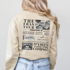 a woman wearing a sweatshirt with a graphic on it