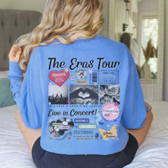 a woman sitting on a bed wearing a blue shirt