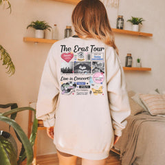 a woman standing in a room wearing a white sweatshirt