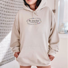 a woman wearing a hoodie with the words the best four printed on it