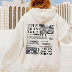 a woman in a white hoodie is walking