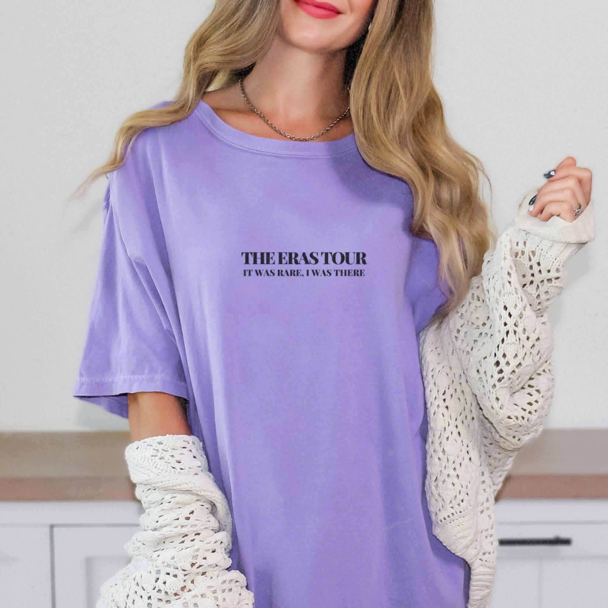 a woman wearing a purple shirt and white gloves