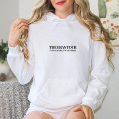 a woman wearing a white hoodie with the words, the story is strange in