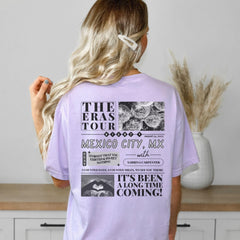 a woman wearing a purple t - shirt that says the eras tour mexico city mix