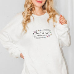 a woman wearing a white sweatshirt with the logo of the pro tour on it