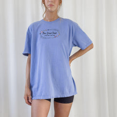 a woman standing in front of a white curtain