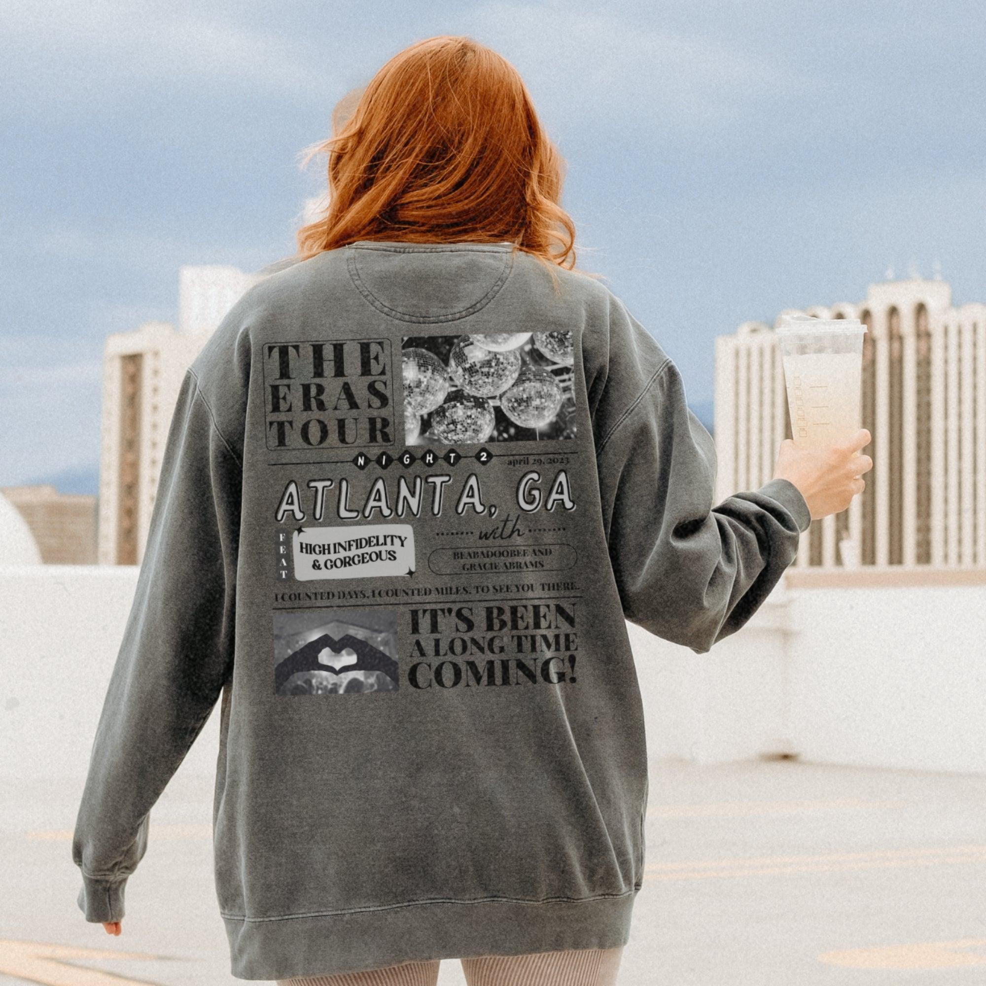 a woman with red hair is holding a book