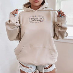 a woman wearing a hoodie with the words the devil tour on it