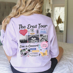 a woman sitting on top of a bed wearing a purple shirt