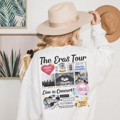 a woman wearing a white sweatshirt and a hat