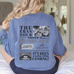 a woman sitting on a bed with her back to the camera