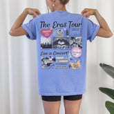 a woman wearing a blue shirt with pictures on it