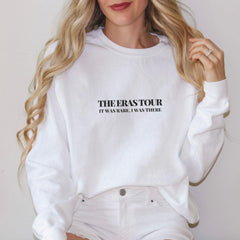 a woman wearing a white sweatshirt with the words the beast tour printed on it