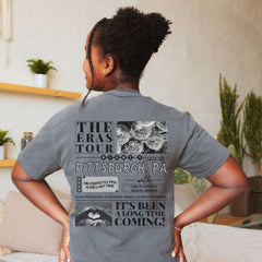 a woman standing in a room with her back to the camera