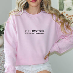 a woman wearing a pink sweatshirt and white shorts