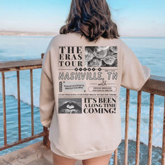 a woman standing on a balcony looking at the ocean