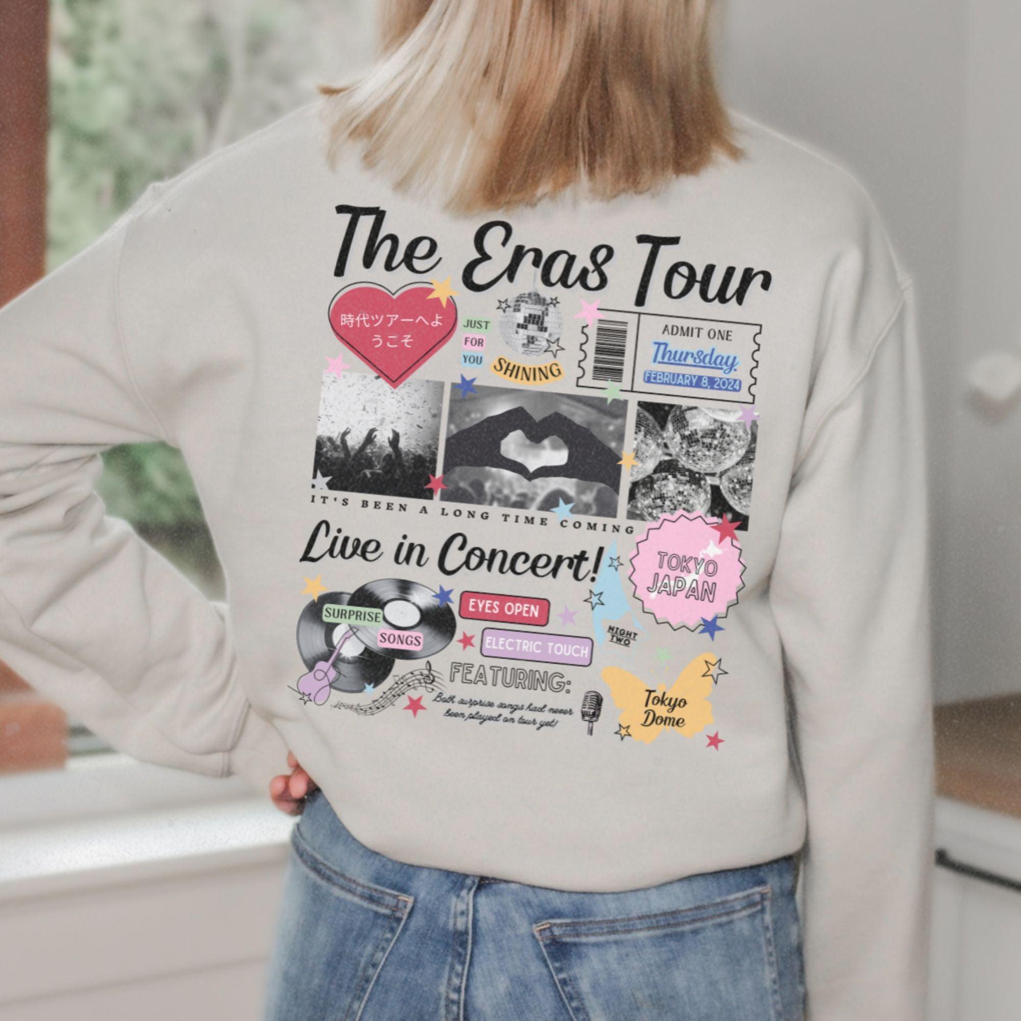 a woman standing in a kitchen with her back to the camera