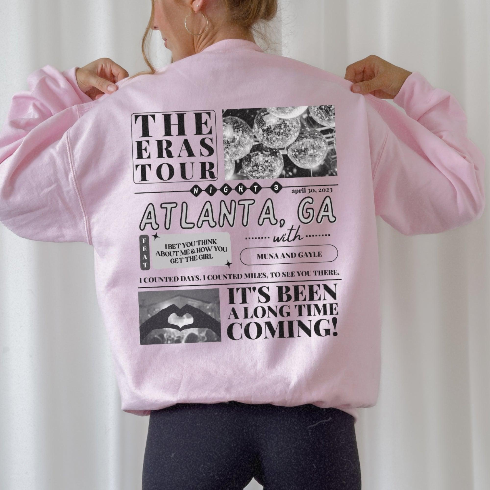 a woman wearing a pink jacket with pictures on it