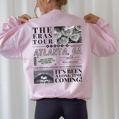 a woman wearing a pink jacket with pictures on it