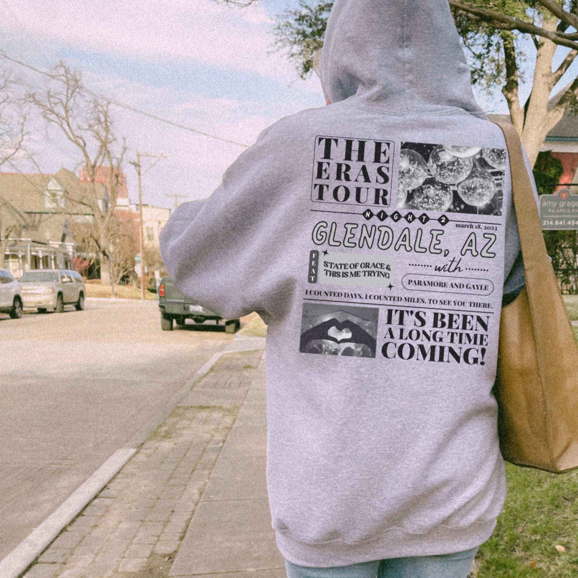 a person in a hoodie walking down the street