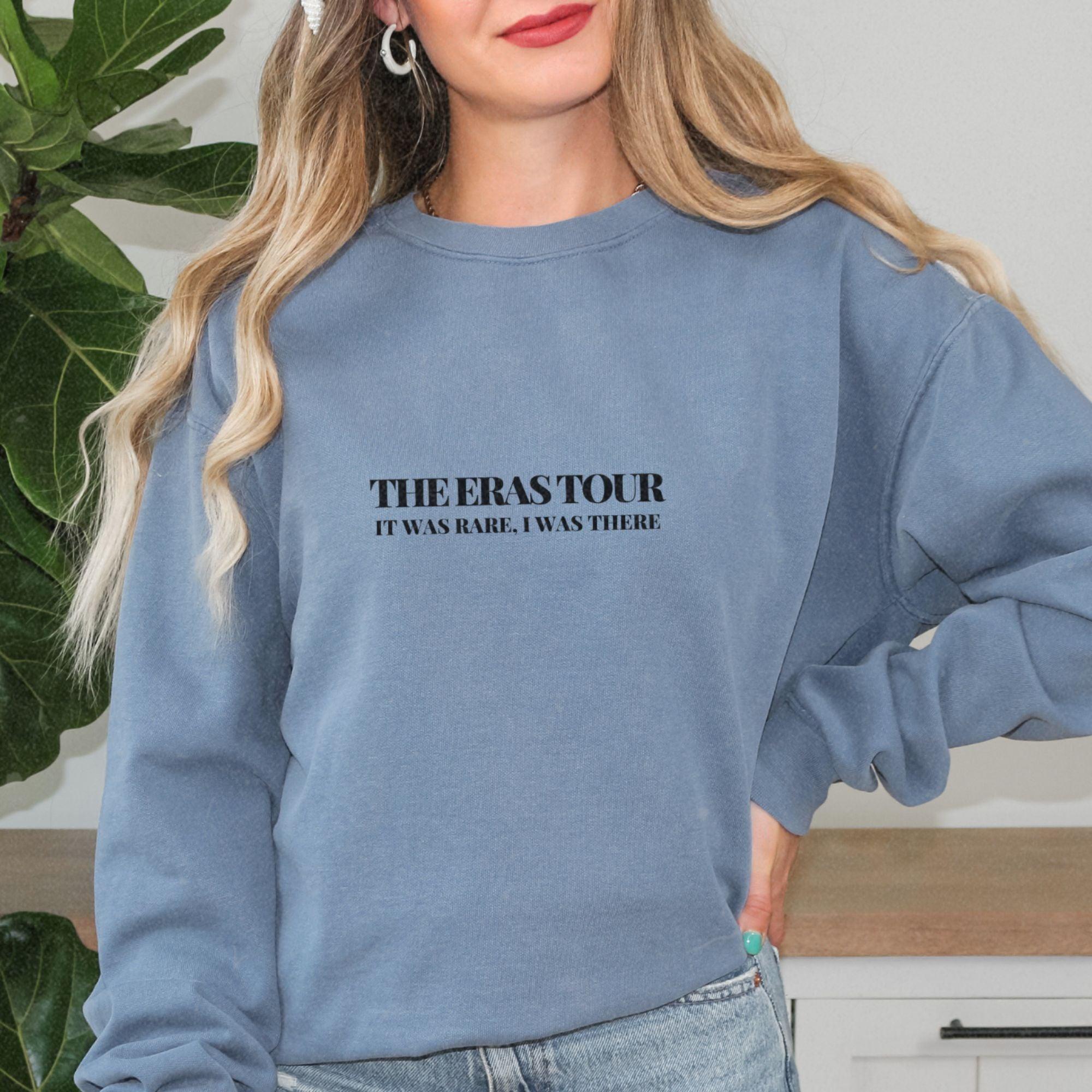 a woman wearing a sweatshirt with the words therastorir on it