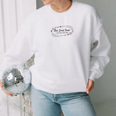 a woman holding a disco ball in her hands