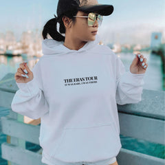 a woman wearing a white hoodie with the words the rapstorr on it