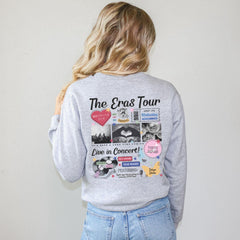 a woman wearing a grey sweatshirt with the words the circus tour printed on it