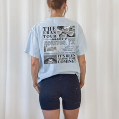 a woman wearing a blue shirt and shorts