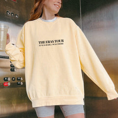 a woman standing in front of a metal wall