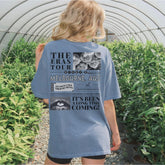 a woman standing in a greenhouse looking at plants