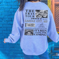 a person standing in front of a blue brick wall