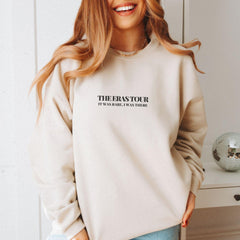 a woman standing in front of a white cabinet