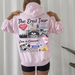 a woman wearing a pink hoodie with pictures on it