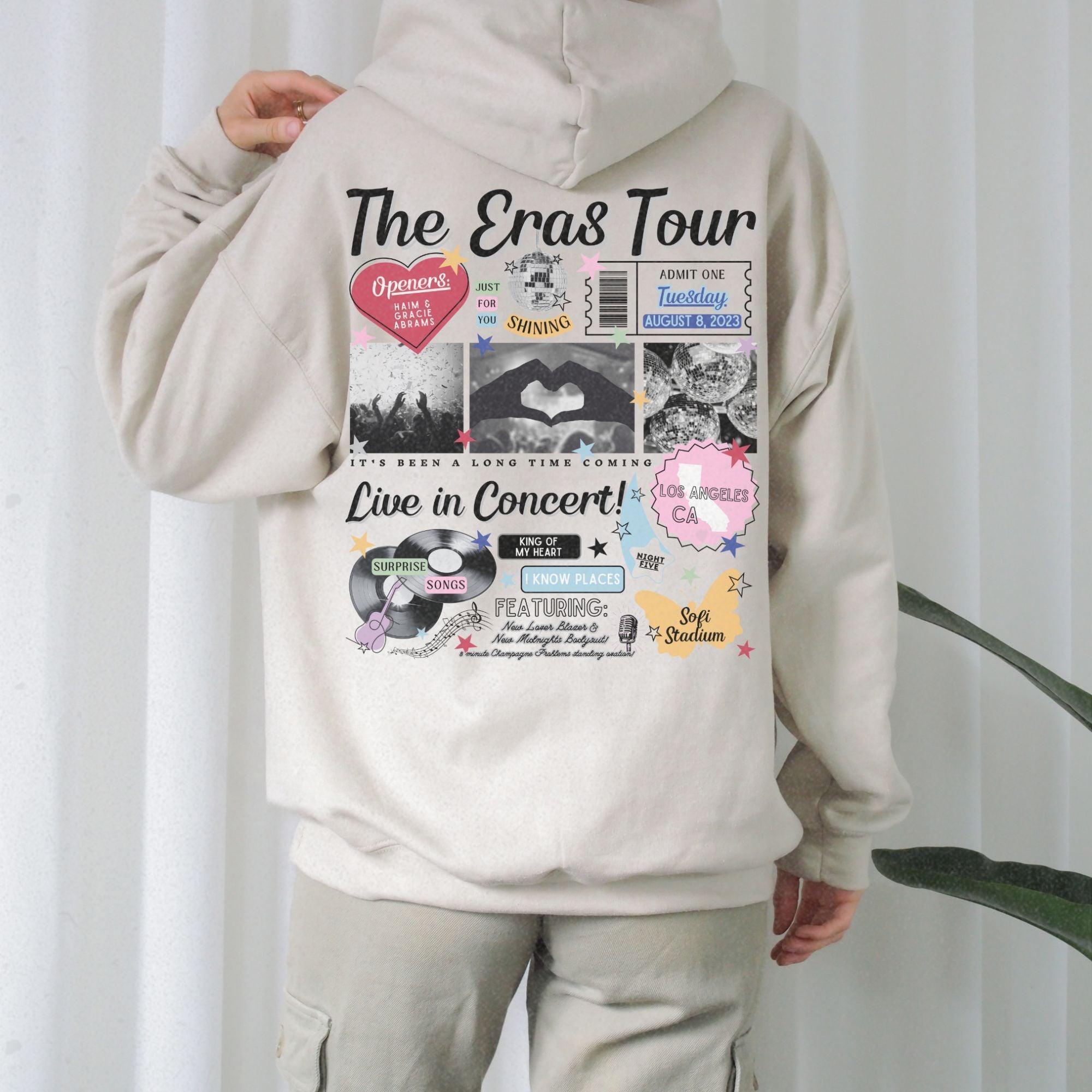 a person wearing a white hoodie with a bunch of stickers on it