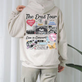 a person wearing a white hoodie with a bunch of stickers on it