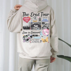 a person wearing a white hoodie with a bunch of stickers on it