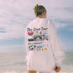 a person standing on a beach with a surfboard