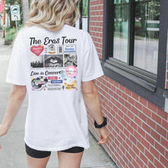 a woman walking down a sidewalk next to a building
