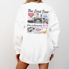 a woman wearing a white sweatshirt with the words the eras tour printed on it