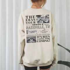 a woman standing in front of a white curtain