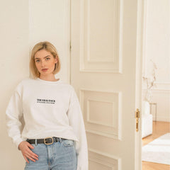 a woman standing in front of a door