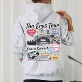 a person wearing a hoodie with a bunch of stickers on it