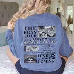 a woman sitting on a bed with her back to the camera