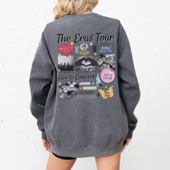 a woman wearing a grey sweatshirt with the words the erase tour on it